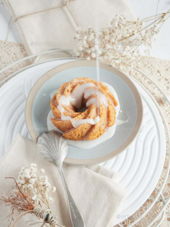 pouring Icing on miniature bundt cake Stock Photo by anal74 PhotoDune